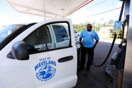 Willie Moody, director of the Waveland Parks and Recreation department, fills his truck with gas as Tropical Storm Gordon approached Waveland, Mississippi, U.S., September 4, 2018. REUTERS/Jonathan Bachman