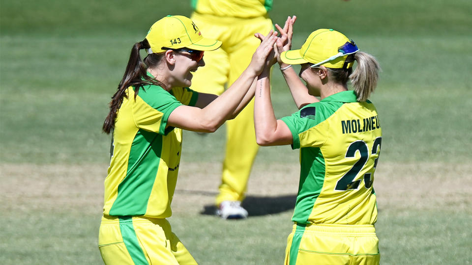 Sophie Molineux of Australia celebrates with team mate Annabel Sutherland after a wicket. (Getty Images)