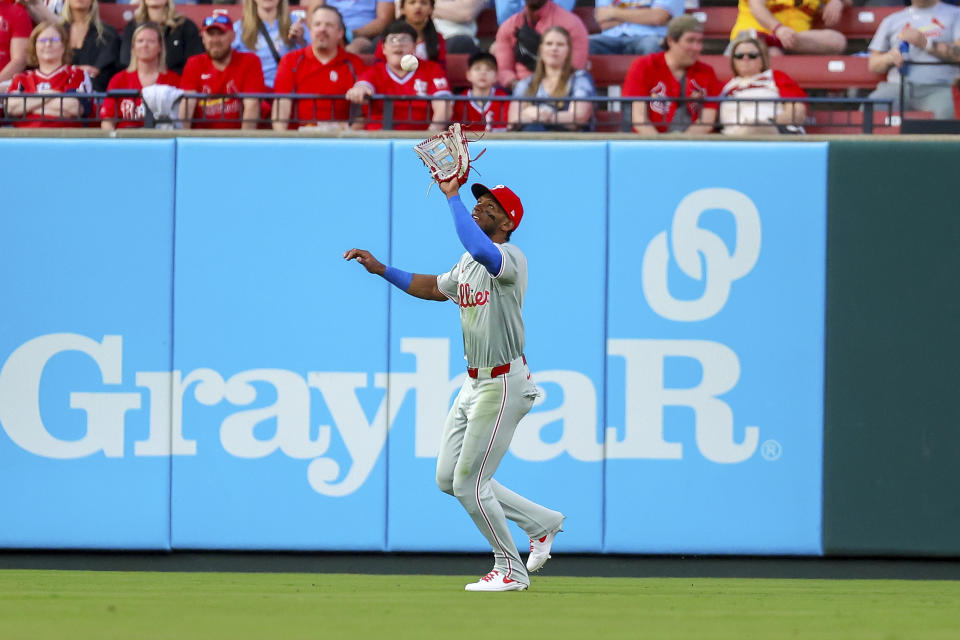 Philadelphia Phillies center fielder Johan Rojas (18) catches a fly ball for an out against St. Louis Cardinals' Iván Herrera during the second inning of a baseball game Monday, April 8, 2024, in St. Louis. (AP Photo/Scott Kane)