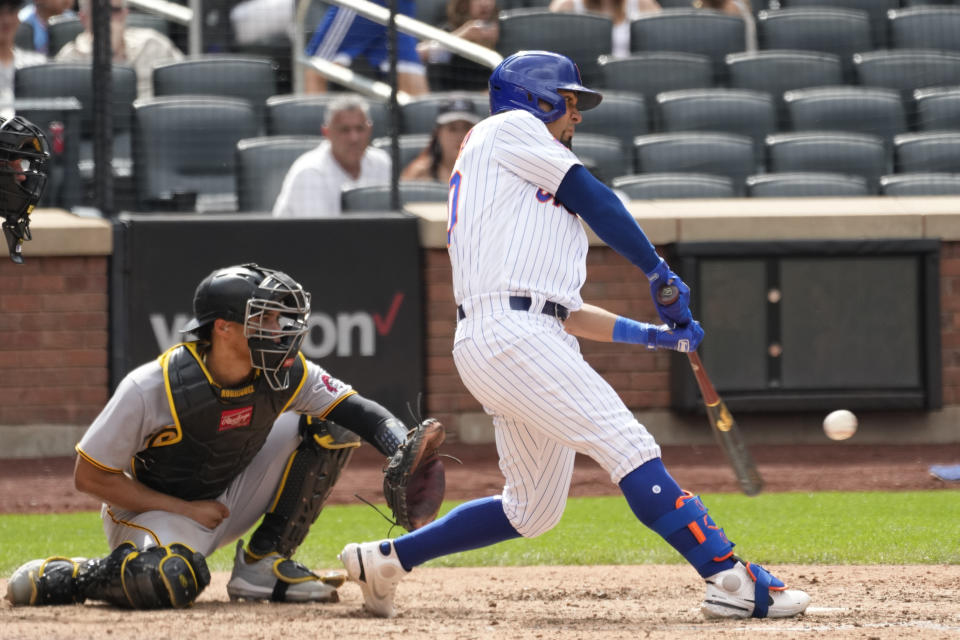 New York Mets' Rafael Ortega hits an RBI single during the seventh inning of a baseball game against the Pittsburgh Pirates, Wednesday, Aug. 16, 2023, in New York. (AP Photo/Mary Altaffer)