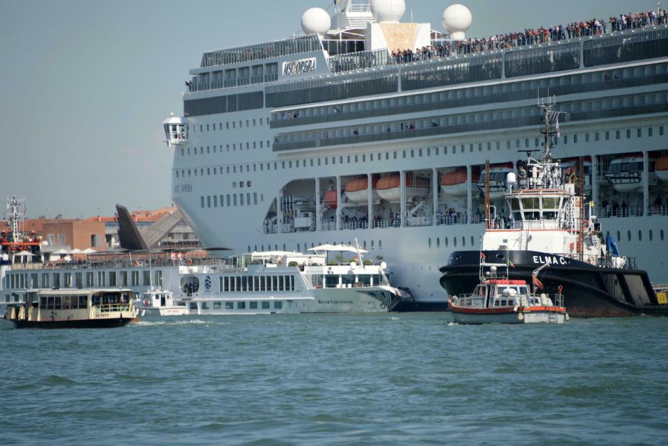 The MSC cruise ship Opera is seen after the collision with a tourist boat, in Venice, Italy, Sunday, June 2, 2019. The towering, out-of-control cruise ship rammed into a dock and a tourist river boat on a busy Venice canal on Sunday morning. Italian media reported that at least five people were injured in the crash. The collision happened about 8:30 a.m. on the Giudecca Canal, a major thoroughfare that leads to Saint Mark's Square in the northeastern Italian city. (Andrea Merola/ANSA via AP)