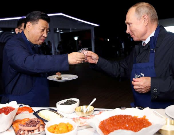 PHOTO: Chinese President Xi Jinping and Russian President Vladimir Putin toast during a visit to the Far East Street exhibition on the sidelines of the Eastern Economic Forum in Vladivostok, Russia, Sept. 11, 2018. (Tass/Pool via Reuters, FILE)