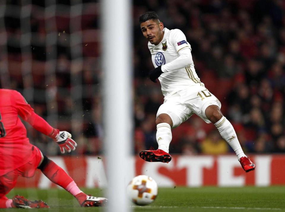 Hosam Aiesh scores past David Ospina (AFP/Getty Images)