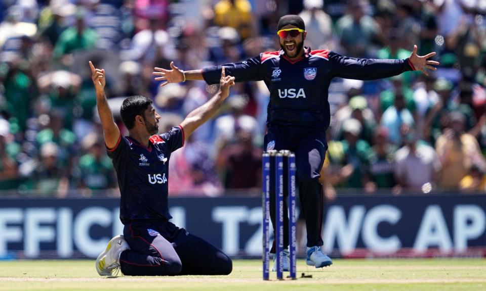 <span>Saurabh Netravalkar (left) and Harmeet Singh celebrate after USA secure a historic win. </span><span>Photograph: Tony Gutierrez/AP</span>