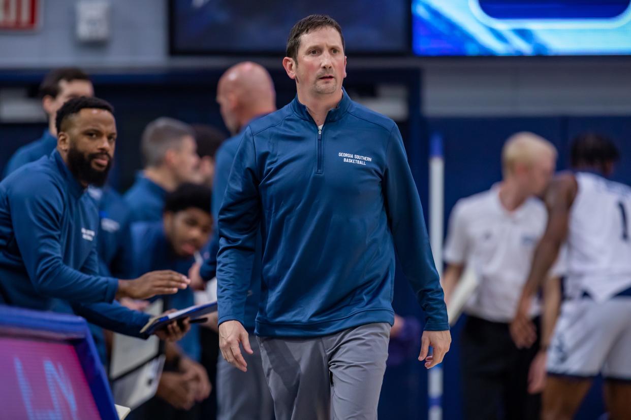 Georgia Southern men's basketball coach Brian Burg patrols the sideline during the host Eagles' 82-71 win over Ball State in the teams' season opener Nov. 9, 2021 at Hanner Fieldhouse in Statesboro.