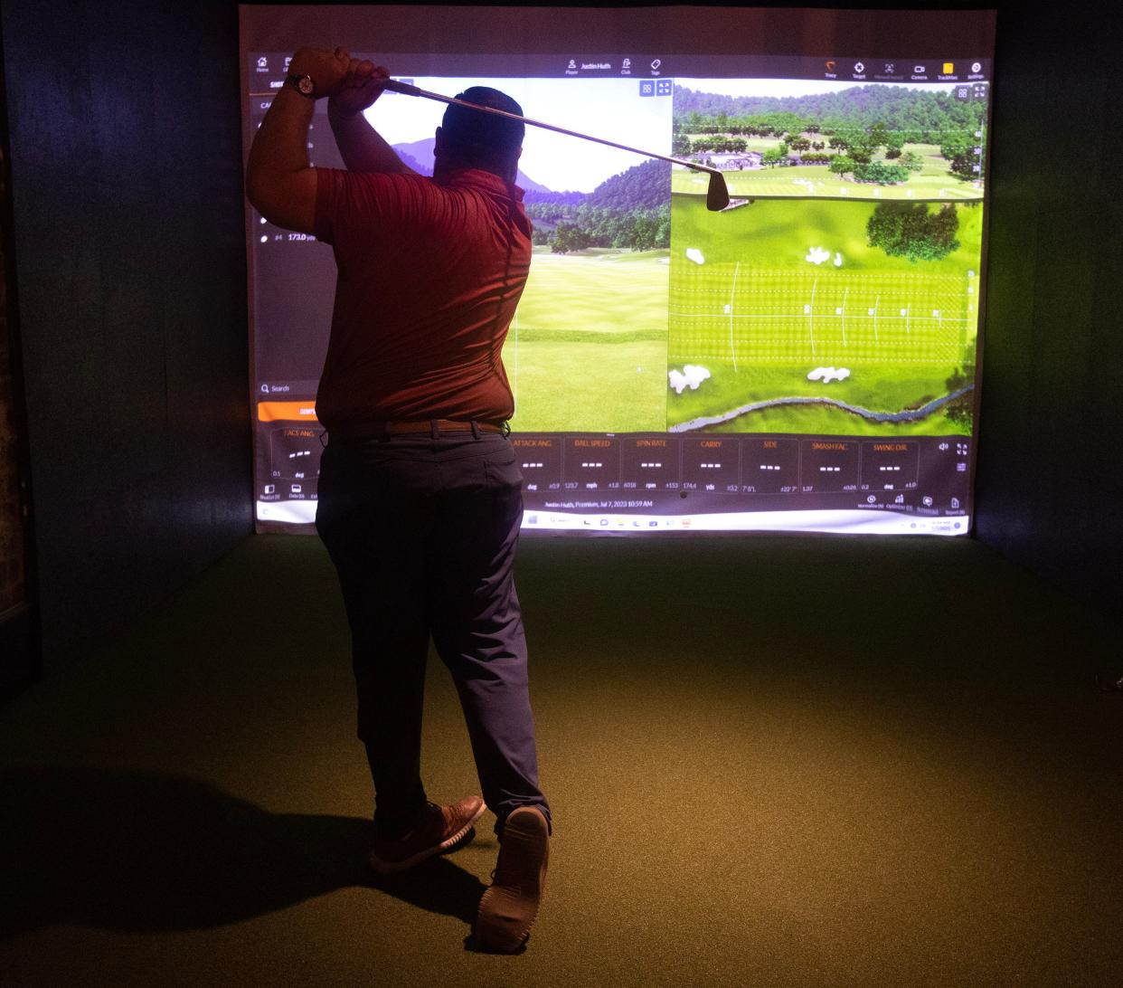 Justin Huth, golf pro at Hupp Gulf, demonstrates the Trackman Performance Studio 9 golf simulator. Hupp Gulf plans to open in downtown Canton in November.