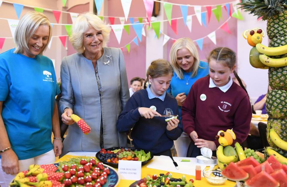 <p>The Duchess of Cornwall helps school children prepare food during a community event entitled A Celebration of Community in Lisnaskea in County Fermanagh.</p>