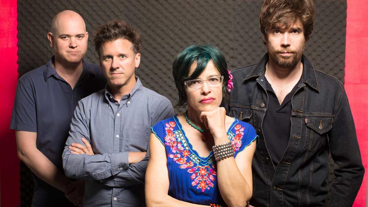  A portrait of members of Superchunk stood in a row. 