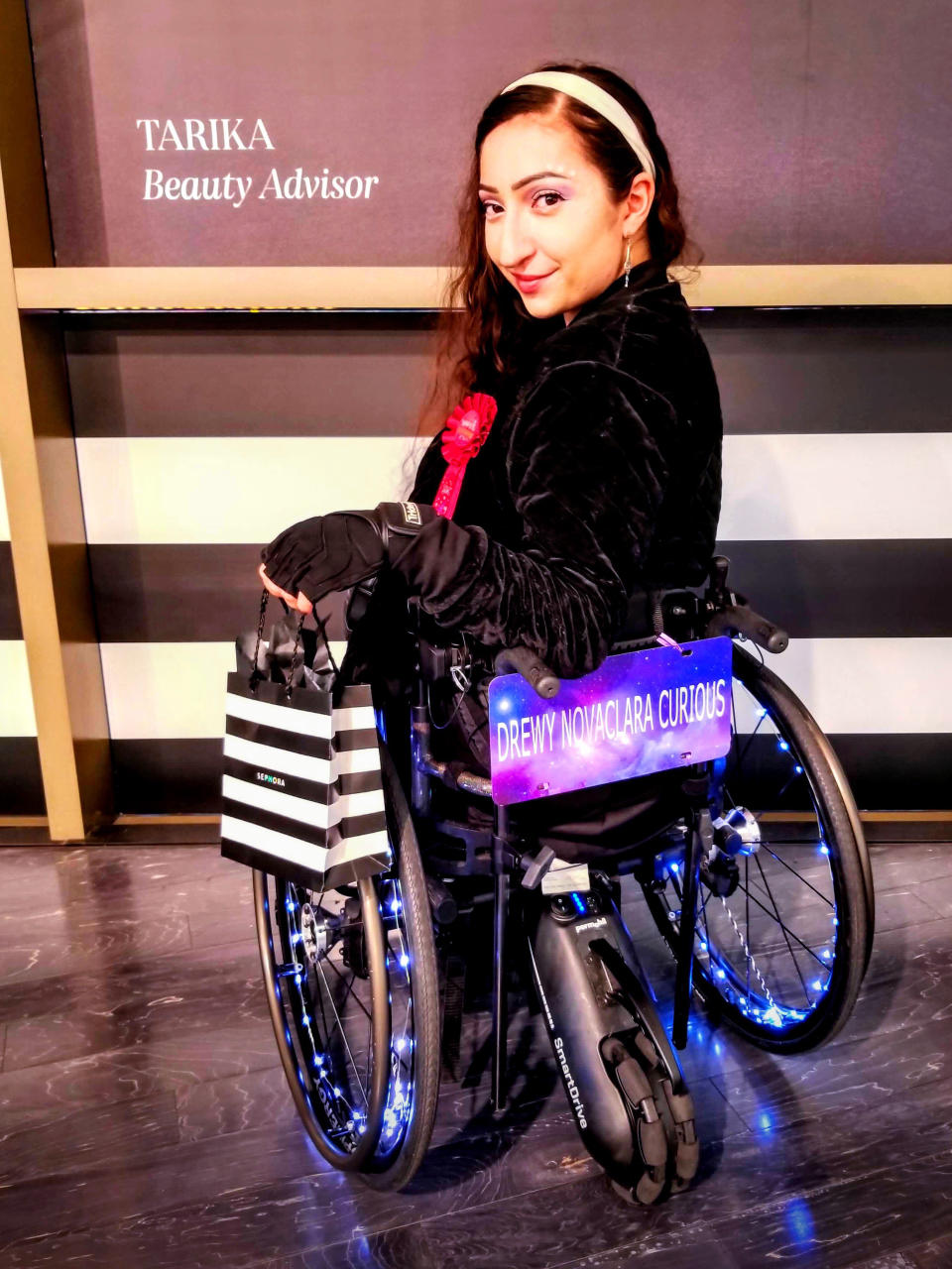 The model and actress pictured with her lit-up wheelchair, which she has named Opal. Doctors told her she was 'too young' to have a stroke.