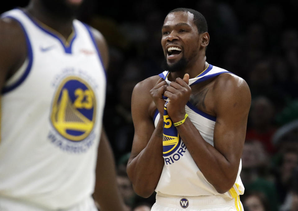 Golden State Warriors forward Kevin Durant (35) celebrates in the final seconds of an NBA basketball game against the Boston Celtics, Saturday, Jan. 26, 2019, in Boston. (AP Photo/Elise Amendola)