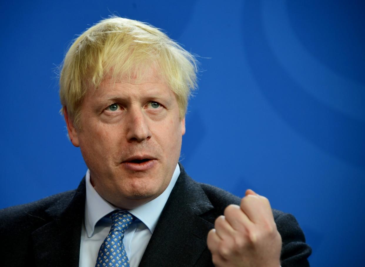 Boris Johnson speaks during a joint press statement with Angela Merkel during a trip to Berlin: EPA