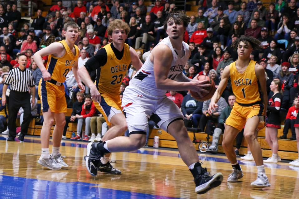 Glenn's Brycen Hannah (14) goes to the basket during the IHSAA Semistate Saturday, Mar. 18, 2023 at North Side Gym in Elkhart.