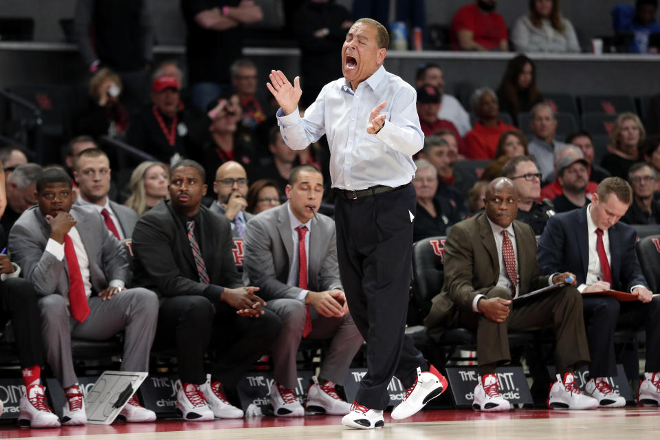 Houston head coach Kelvin Sampson claps and yells as he goes along the bench during the second half of an NCAA college basketball game against Connecticut Thursday, Jan. 23, 2020, in Houston. (AP Photo/Michael Wyke)