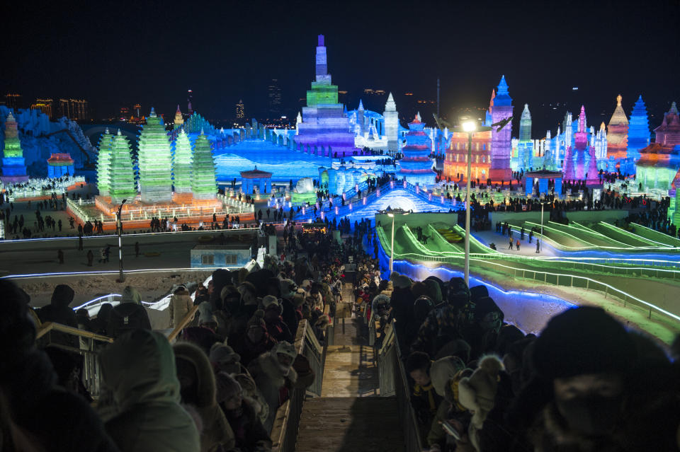 Tourists visit illuminated ice sculptures at Ice and Snow World park on Jan. 5, 2019, in Harbin, China. (Photo: Tao Zhang/Getty Images)