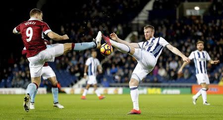 Britain Football Soccer - West Bromwich Albion v Burnley - Premier League - The Hawthorns - 21/11/16 Burnley's Sam Vokes in action with West Bromwich Albion's Chris Brunt Reuters / Darren Staples Livepic