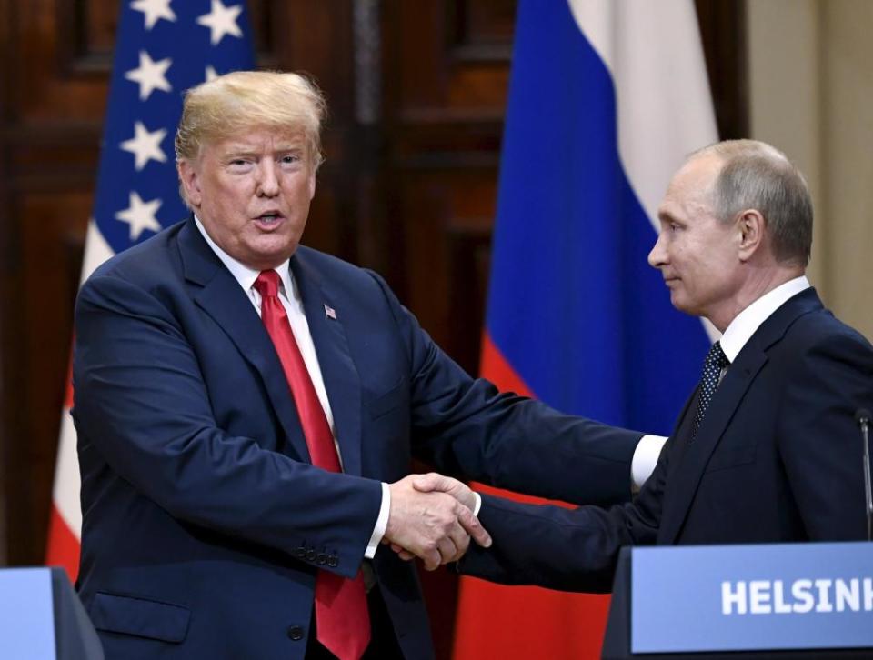 Trump shakes hands with Putin after his conversation at the summit in Helsinki in 2018.