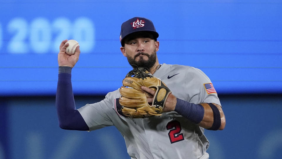 Eddy Alvarez already has speed-skating silver. He'll play for gold with the U.S. baseball team against Japan on Saturday. (AP Photo/Sue Ogrocki)