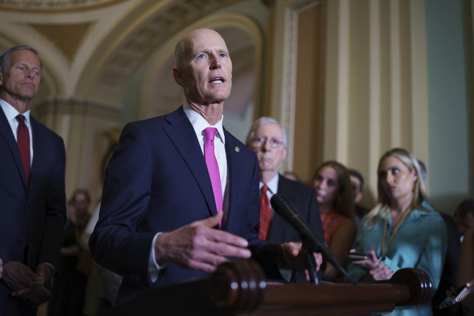 Sen. Rick Scott, R-Fla., joins Senate Minority Leader Mitch McConnell, R-Ky., right, and the GOP leadership talk to reporters about progress on an infrastructure bill and voting rights legislation, at the Capitol in Washington, Tuesday, June 15, 2021. (AP Photo/J. Scott Applewhite)