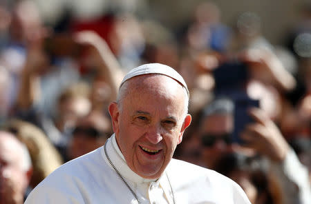 Pope Francis arrives to lead his Wednesday general audience in Saint Peter's square at the Vatican, May 3, 2017. REUTERS/Tony Gentile