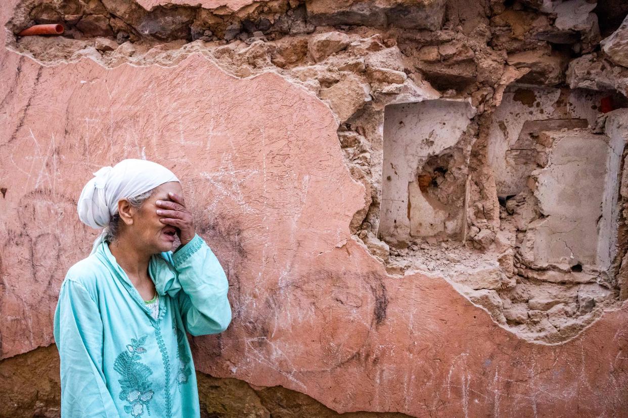 A woman heartbroken by the destruction to her home in the old city of Marrakech (AFP via Getty Images)