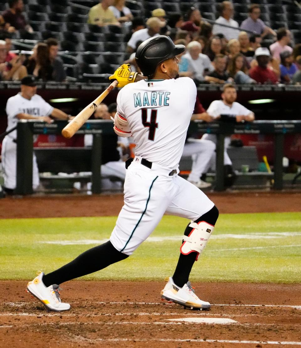 Sep 15, 2022; Phoenix, Arizona, USA; Arizona Diamondbacks Ketel Marte (4) hits a home run against the San Diego Padres in the fourth inning at Chase Field.