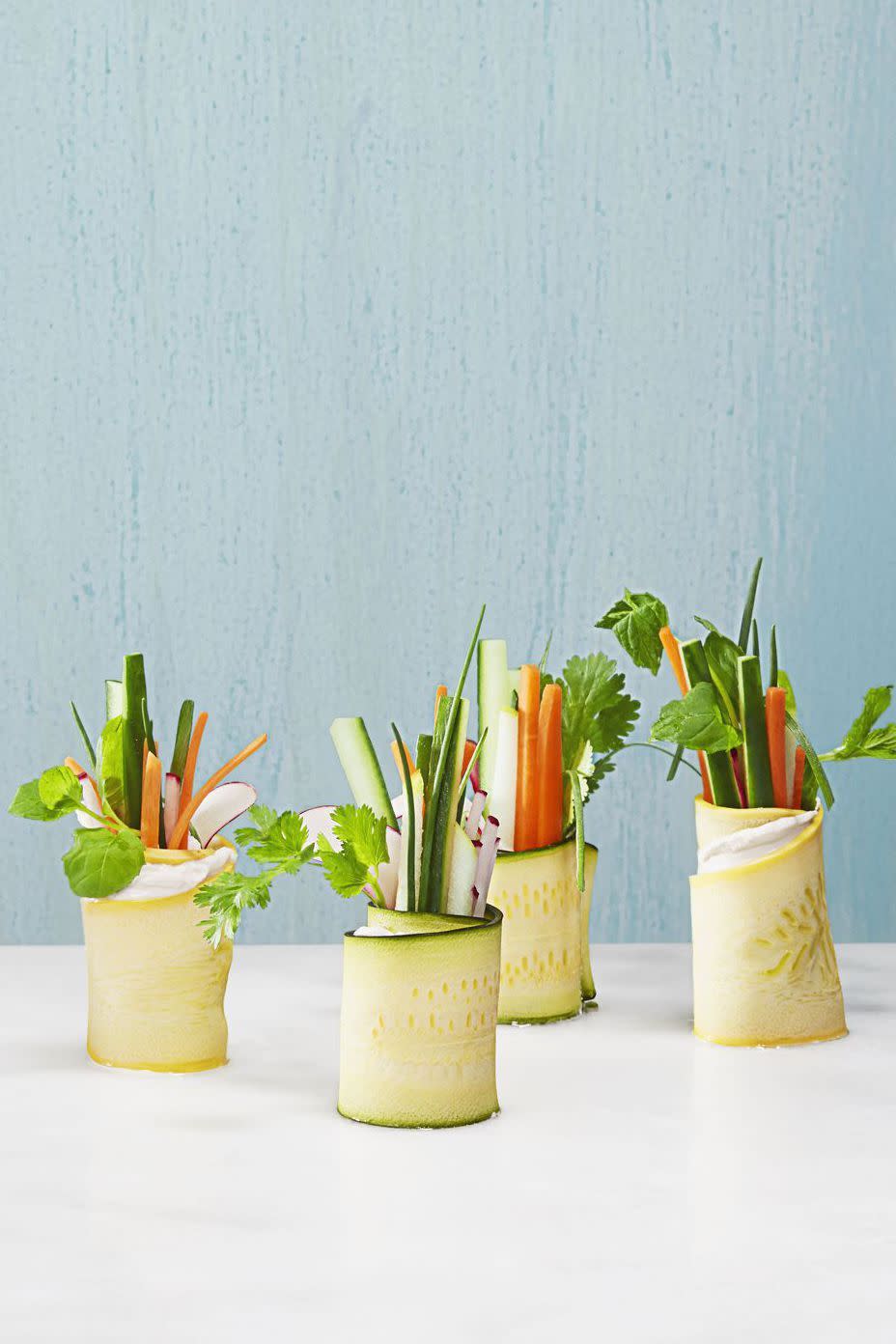 <p>Wrap up your garden's bounty in wide zucchini or squash ribbons for a veggie-filled appetizer. </p><p><em><a href="https://www.goodhousekeeping.com/food-recipes/party-ideas/how-to/a33054/how-to-make-veggie-rolls/" rel="nofollow noopener" target="_blank" data-ylk="slk:Get the recipe for Summer Veggie Rolls »;elm:context_link;itc:0;sec:content-canvas" class="link ">Get the recipe for Summer Veggie Rolls » </a></em></p>