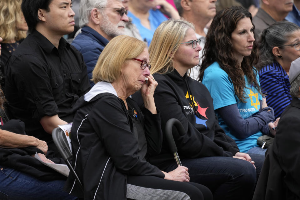 Relatives of Daniel Stein, one of 11 worshippers killed five years ago on Oct 27, 2018, when a gunman opened fire at the Tree of Life Synagogue in the Squirrel Hill neighborhood of Pittsburgh, attend a Commemoration Ceremony in Schenley Park in Pittsburgh on Friday, Oct. 27, 2023. (AP Photo/Gene J. Puskar)