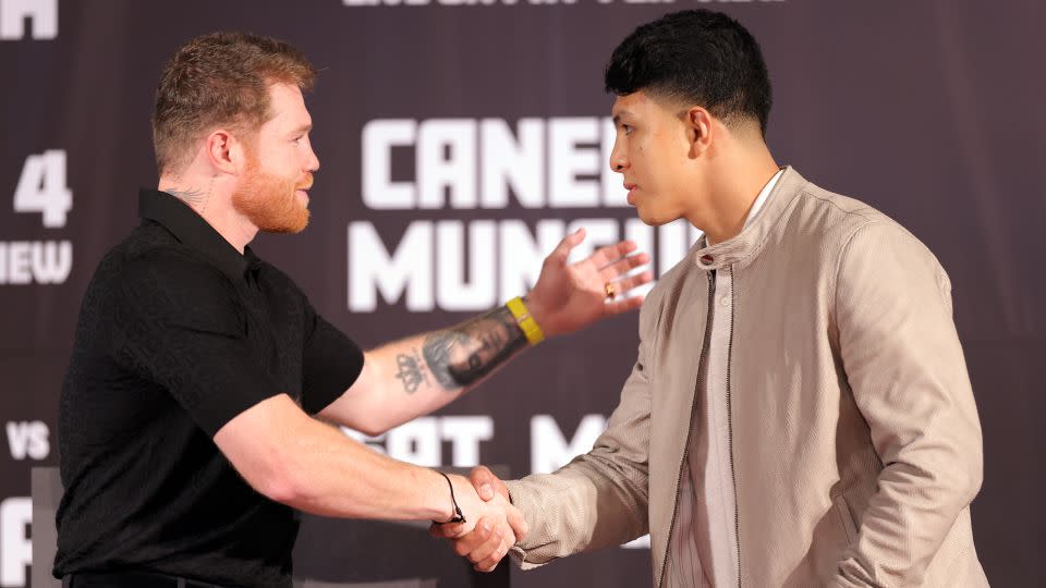 Álvarez and Munguía shake hands during a media conference to preview their super middleweight fight at The Beverly Hills Hotel on March 19, 2024. - Katelyn Mulcahy/Getty Images