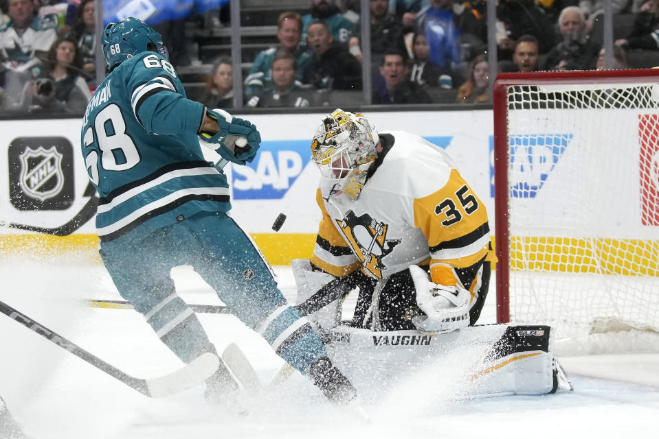 Pittsburgh Penguins goaltender Tristan Jarry (35) defends against a shot attempt by San Jose Sharks left wing Mike Hoffman (68) during the first period of an NHL hockey game in San Jose, Calif., Saturday, Nov. 4, 2023. (AP Photo/Jeff Chiu)