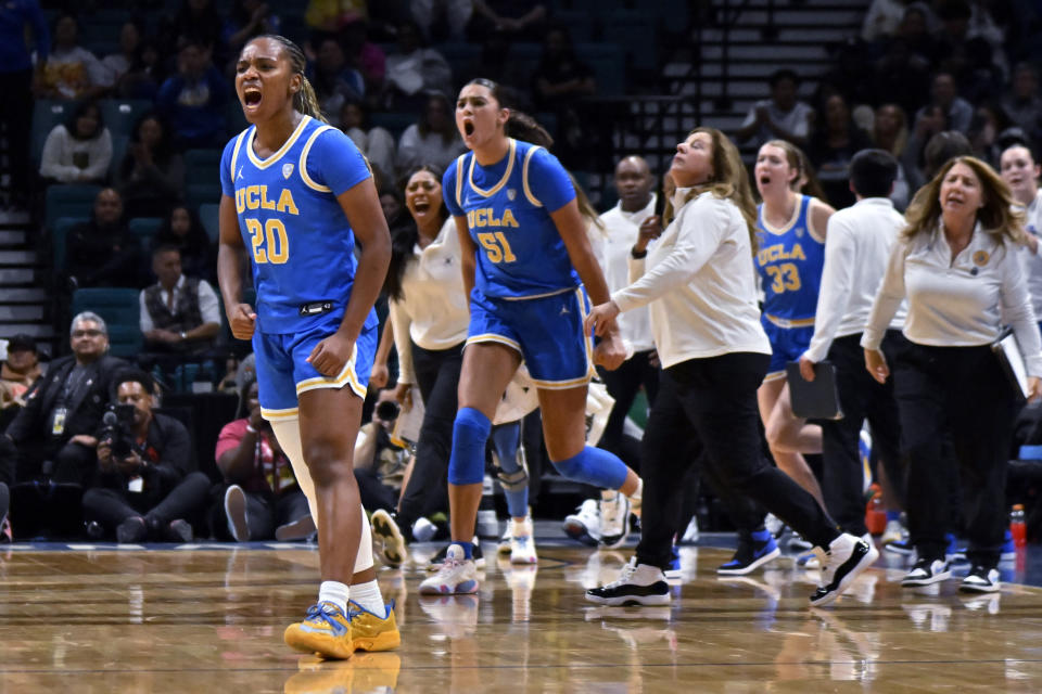 UCLA guard Charisma Osborne (20) reacts after a 3-point basket against Southern California during the first half of an NCAA college basketball game in the semifinals of the Pac-12 women's tournament Friday, March 8, 2024, in Las Vegas. (AP Photo/David Becker)