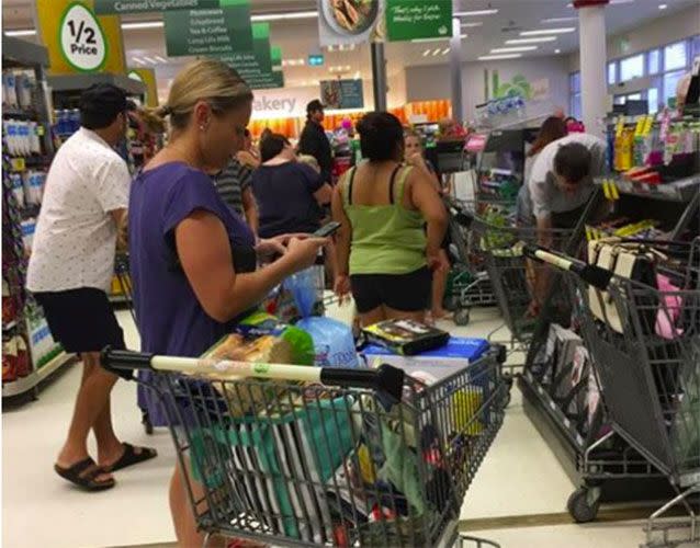 Lengthy queues at every checkout as people on the Sunshine Coast stock up on supplies. Picture: Nicole Powell