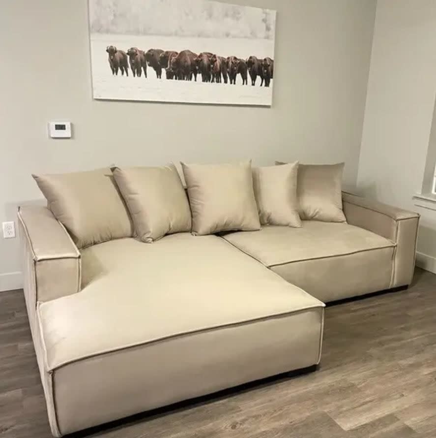 tan shiny large sectional couch