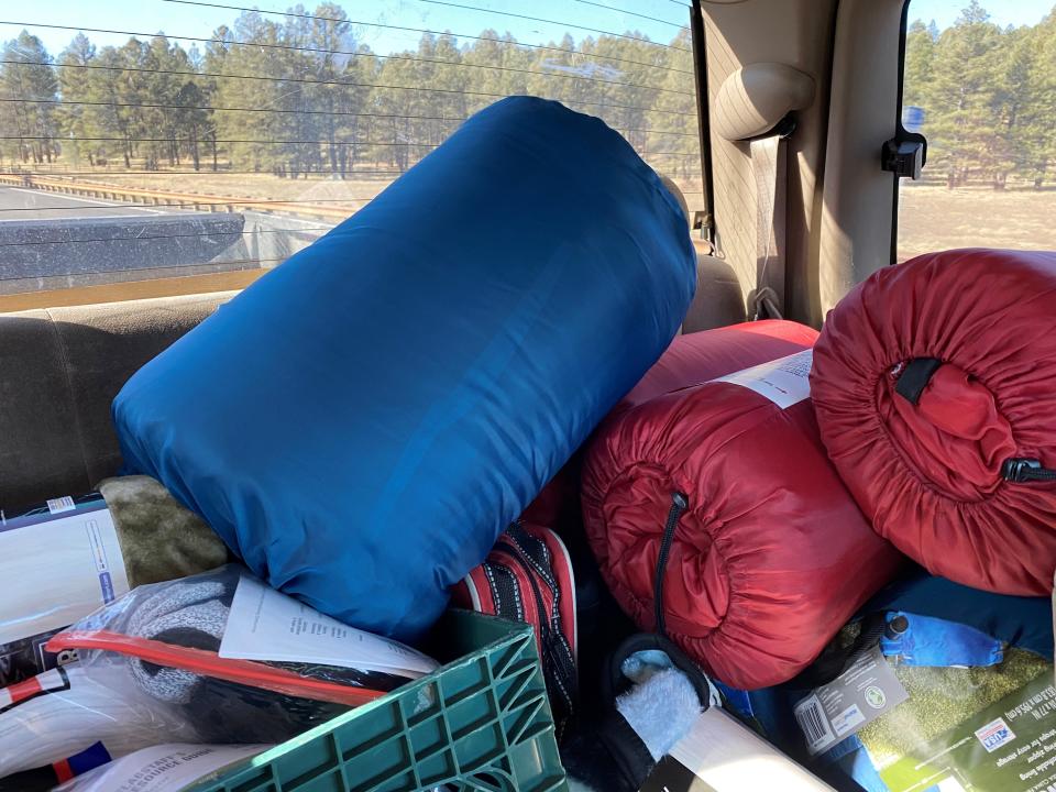 The Catholic Charities PATH team conducts outreach to people living on public lands in northern Arizona, including providing sleeping bags and other life-saving supplies.