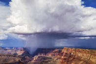 <p>A lightning bolt at the Grand Canyon hits on the top of one of the little island plateaus on the eastern side as seen from Navajo Point on Aug. 4, 2017. (Photo: Mike Olbinski/Caters News) </p>