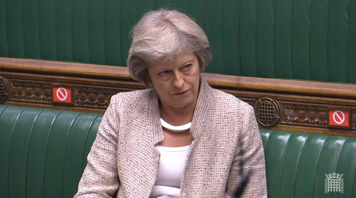 Former prime minister Theresa May listens to the response from Cabinet Office minister Michael Gove after she asked a question during a session in the House of Commons, London, on the appointment of the National Security Adviser.