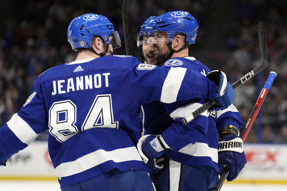 Tampa Bay Lightning left wing Alex Killorn celebrates his goal against the New Jersey Devils with left wing Tanner Jeannot (84) during the.second period of an NHL hockey game Sunday, March 19, 2023, in Tampa, Fla. (AP Photo/Chris O'Meara)