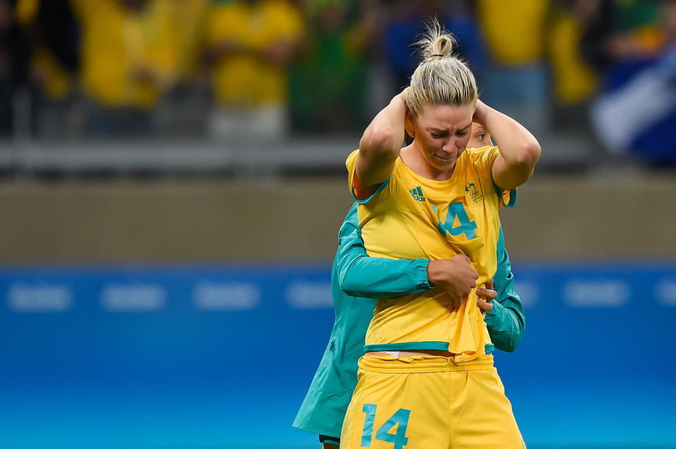 <p>Alanna Kennedy of Australia is embraced after their 0-0 (6-7 PSO) loss to Brazil during the Women’s Football Quarterfinal match at Mineirao Stadium on Day 7 of the Rio 2016 Olympic Games on August 12, 2016 in Belo Horizonte, Brazil. (Photo by Pedro Vilela/Getty Images) </p>