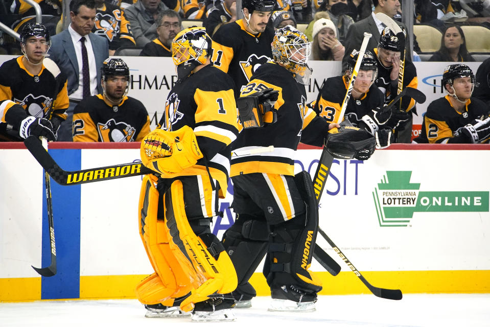 Pittsburgh Penguins goaltender Tristan Jarry (35) replaces Casey DeSmith (1) during the second period of the team's NHL hockey game against the St. Louis Blues in Pittsburgh, Wednesday, Jan. 5, 2022. (AP Photo/Gene J. Puskar)