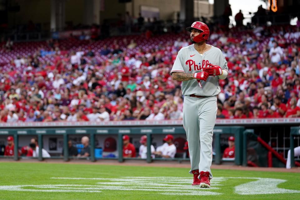 Philadelphia Phillies right fielder Nick Castellanos (8) walks back to the dugout after scoring a run in the third inning of a baseball game against the Cincinnati Reds, Monday, Aug. 15, 2022, at Great American Ball Park in Cincinnati. 