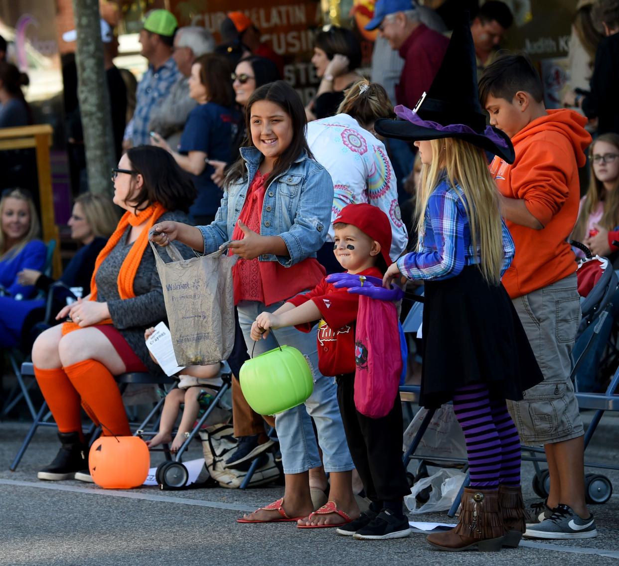 Kids in costume wait for candy during a previous Halloween Parade in Bartow.