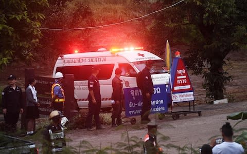  An ambulance leaves the Tham Luang cave area after divers evacuated - Credit: LILLIAN SUWANRUMPHA /AFP