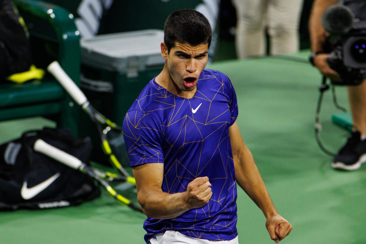 INDIAN WELLS, CALIFORNIA - MARCH 16: Carlos Alcaraz of Spain celebrates his victory over Gael Monfils in the fourth round of the BNP Paribas Ope on March 16, 2022 in Indian Wells, California. (Photo by TPN/Getty Images)