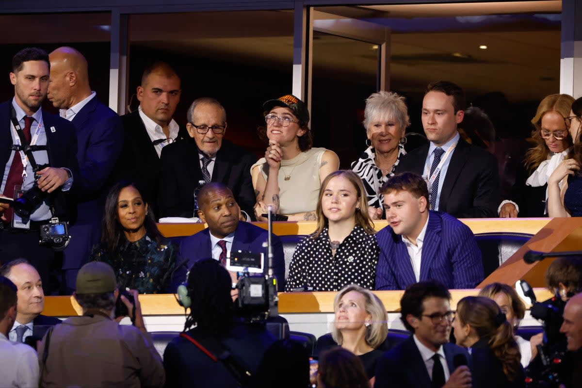 Ella Emhoff (back left) beside her brother Cole Emhoff (back right), as well as the children of Tim Walz; Hope and Gus (front left and right) (AP)