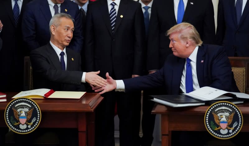 Chinese Vice Premier Liu He and U.S. President Donald Trump shake hands after signing "phase one" of the U.S.-China trade agreement at the White House in Washington