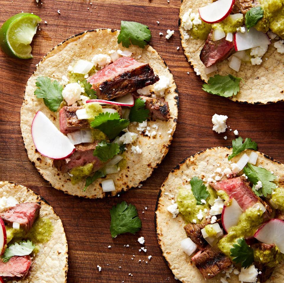 <p>This flavorful handheld food has it all—tender marinated <a href="https://www.delish.com/cooking/recipe-ideas/a39427643/carne-asada-recipe/" rel="nofollow noopener" target="_blank" data-ylk="slk:skirt steak;elm:context_link;itc:0;sec:content-canvas" class="link ">skirt steak</a>, an aromatic <a href="https://www.delish.com/cooking/recipe-ideas/a36292474/homemade-tortillas-recipe/" rel="nofollow noopener" target="_blank" data-ylk="slk:corn tortilla;elm:context_link;itc:0;sec:content-canvas" class="link ">corn tortilla</a>, and all of the classic street taco toppings. Served for lunch or dinner, these are delicious with a hearty side of <a href="https://www.delish.com/cooking/recipe-ideas/a35047896/refried-pinto-beans-recipe/" rel="nofollow noopener" target="_blank" data-ylk="slk:refried beans;elm:context_link;itc:0;sec:content-canvas" class="link ">refried beans</a> and <a href="https://www.delish.com/cooking/recipe-ideas/a27132897/mexican-rice-recipe/" rel="nofollow noopener" target="_blank" data-ylk="slk:rice;elm:context_link;itc:0;sec:content-canvas" class="link ">rice</a>, or you can keep it light with <a href="https://www.delish.com/cooking/recipe-ideas/recipes/a43194/mexican-corn-salad-recipe/" rel="nofollow noopener" target="_blank" data-ylk="slk:corn salad;elm:context_link;itc:0;sec:content-canvas" class="link ">corn salad</a>.</p><p>Get the <strong><a href="https://www.delish.com/cooking/recipe-ideas/a43214328/carne-asada-tacos-recipe/" rel="nofollow noopener" target="_blank" data-ylk="slk:Carne Asada Tacos recipe;elm:context_link;itc:0;sec:content-canvas" class="link ">Carne Asada Tacos recipe</a></strong>.</p>