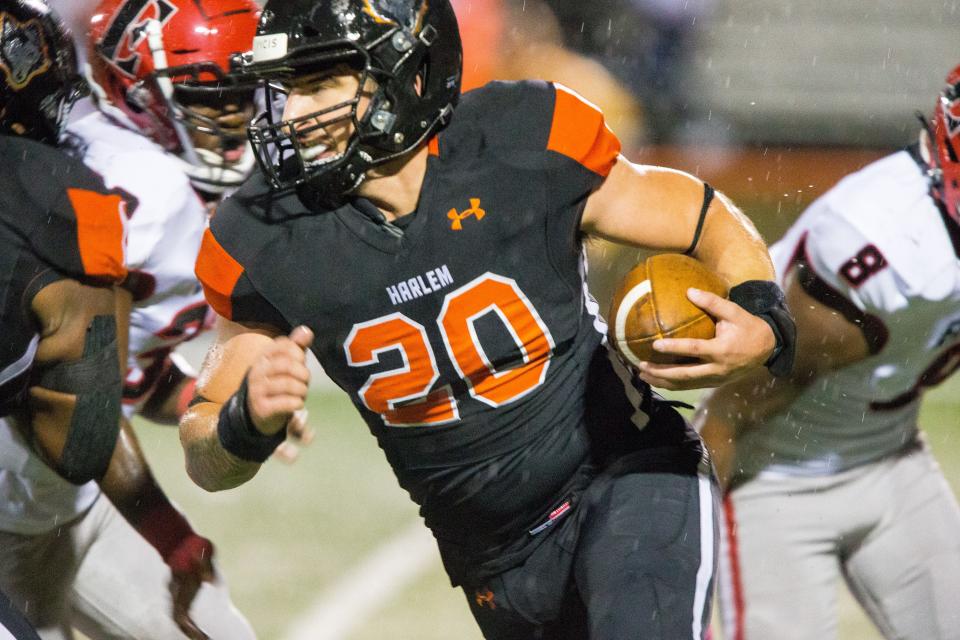 Harlem's Adrian Palos runs against East in the second quarter of their game on Friday, Sept. 24, 2021, at Harlem High School in Machesney Park.