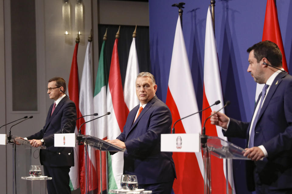 Hungarian prime minister Viktor Orban, center, Poland's prime minister, Matteusz Morawiecki, left, and former interior minister of Italy, Matteo Salvini attend a joint press conference in Budapest, Hungary, Thursday, April 1, 2021. Hungarian prime minister Viktor Orban hosted talks with right-wing politicians, Poland's prime minister, Matteusz Morawiecki, and former interior minister of Italy, Matteo Salvini, a potential opening step toward a new populist political force on the European stage. (AP Photo/Laszlo Balogh)