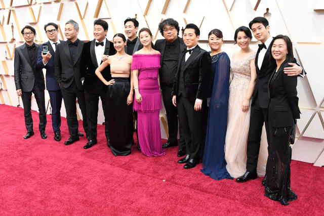 Parasite director Bong Joon Ho and cast members walking on the red carpet  at the 92nd Annual Academy Awards held at the Dolby Theatre in Hollywood,  California on Feb. 9, 2020. (Photo