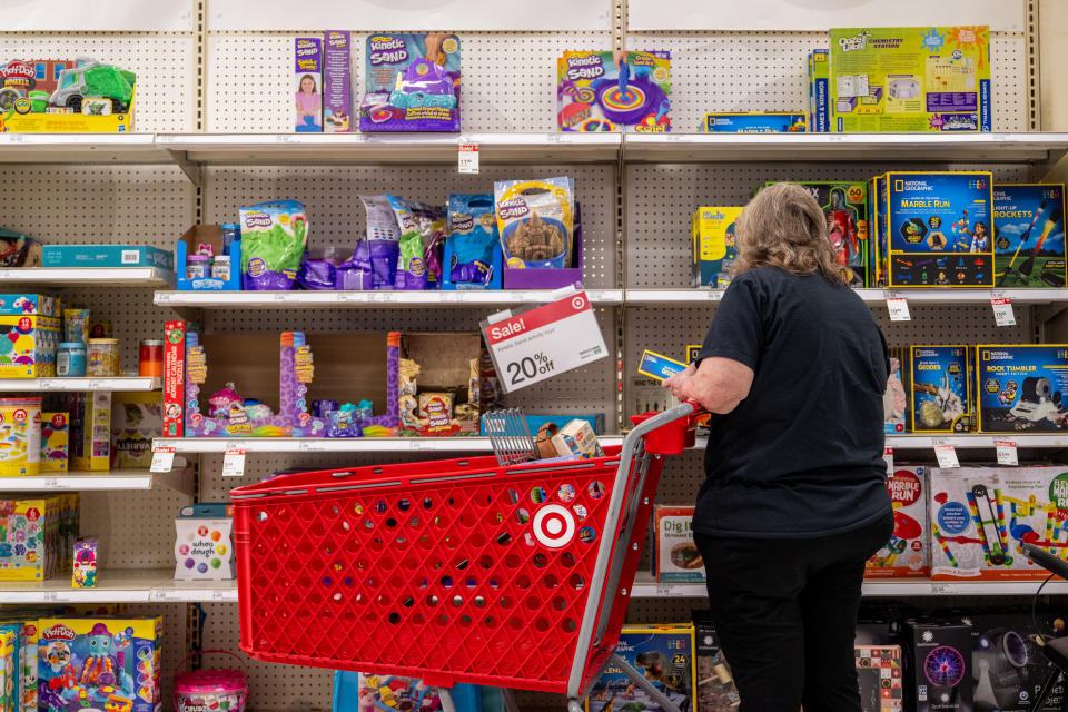 A customer shops for gifts at discounted prices in a Target store in Austin, Texas. (Credit: Brandon Bell, Getty Images)