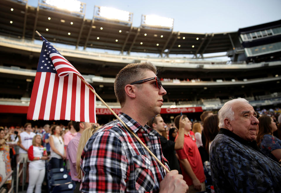 A Republican supporter holds an American flag